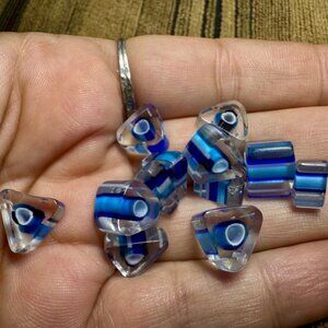 Blue and White Glass Art with Intricate Eye Patterns